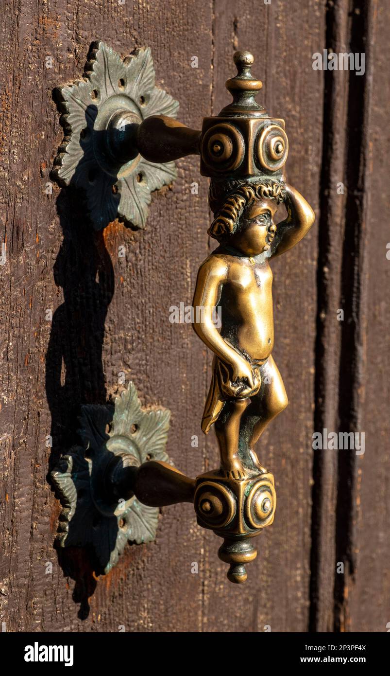 Ornate brass door handle Venice, Italy Stock Photo