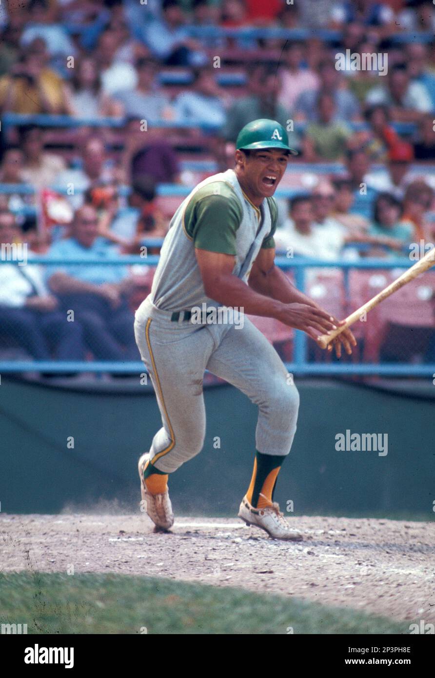 Oakland A's Reggie Jackson (9) in action during a game from his 1969  season. Reggie Jackson played for 21 years with 4 different teams and was  inducted to the Baseball Hall of