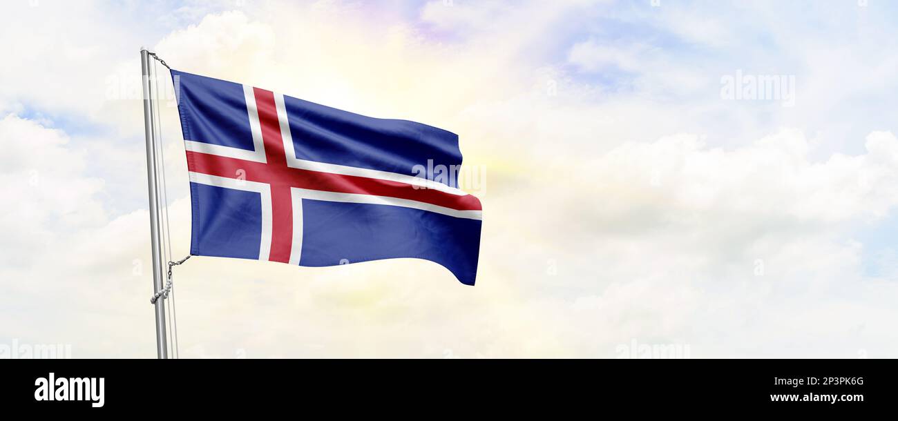 Iceland flag waving on sky background. 3D Rendering Stock Photo - Alamy