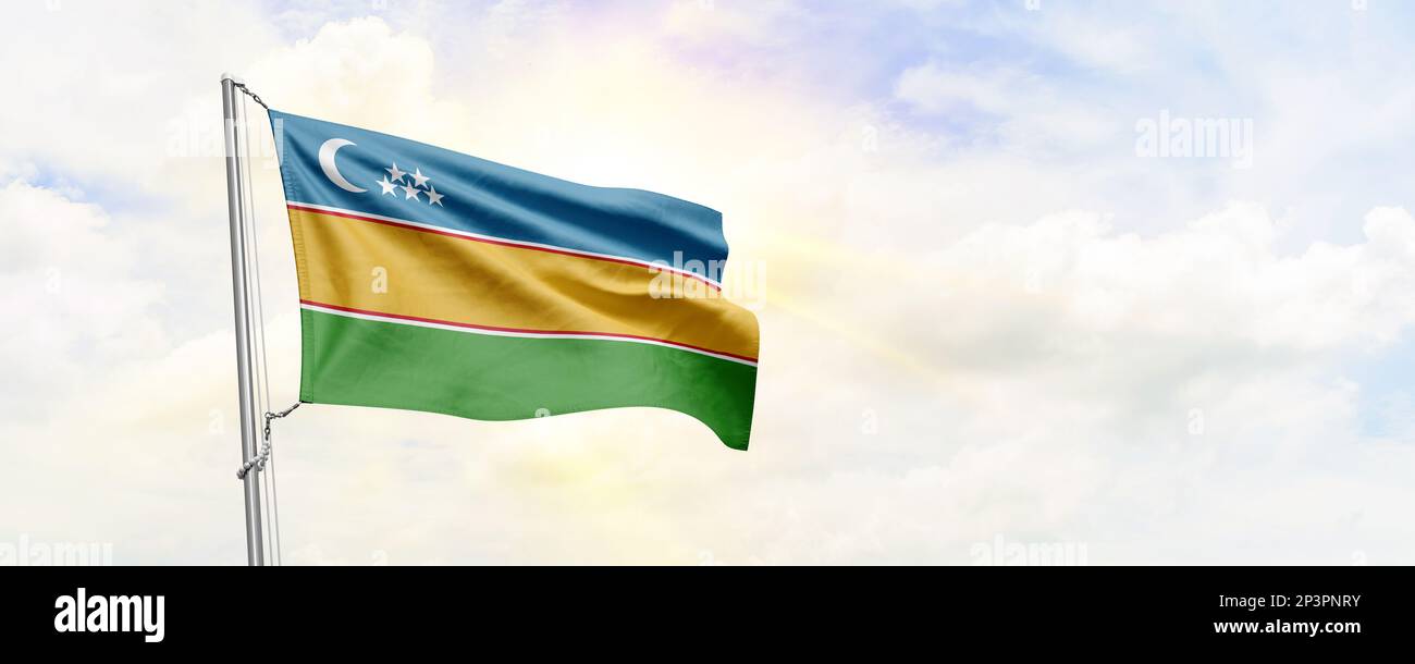 Karakalpakstan flag waving on sky background. 3D Rendering Stock Photo