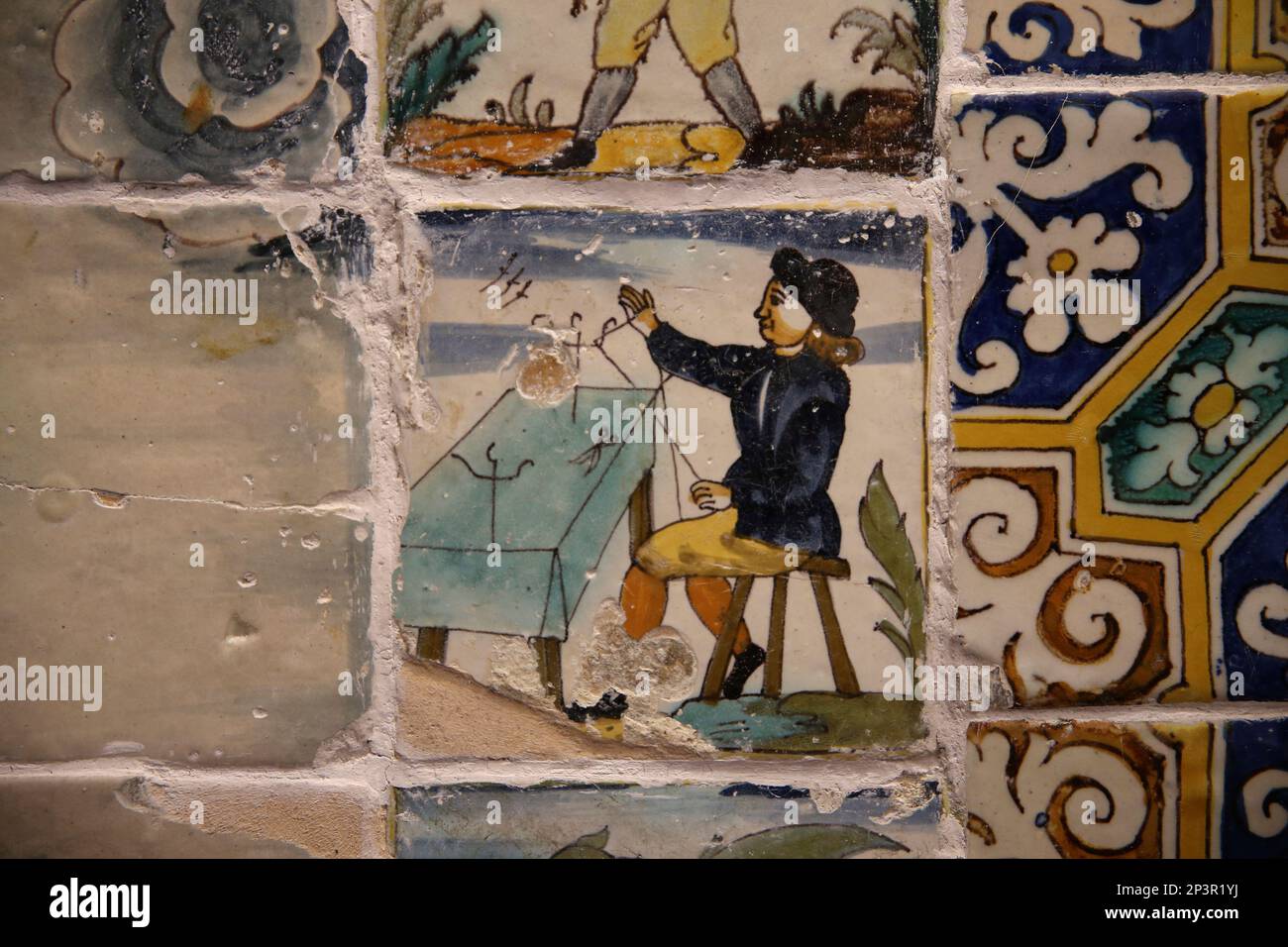 Catalan tiles trade. 19th century.  Man working threads. Kitchen. Monastery of Pedralbes. Barcelona. Catalonia. Spain. Stock Photo