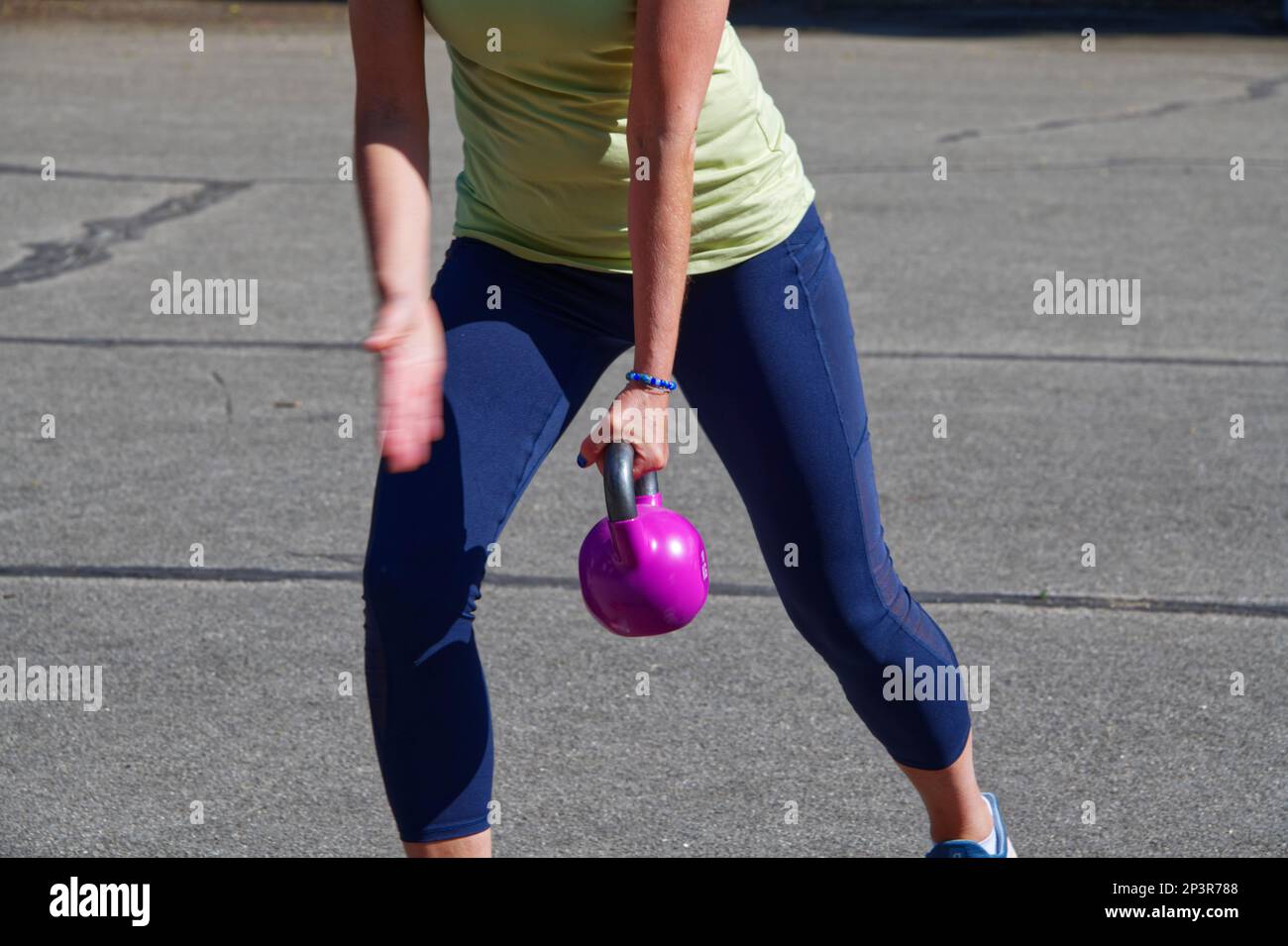 View of European women during a sport training outdoors on a public area in the summer Stock Photo