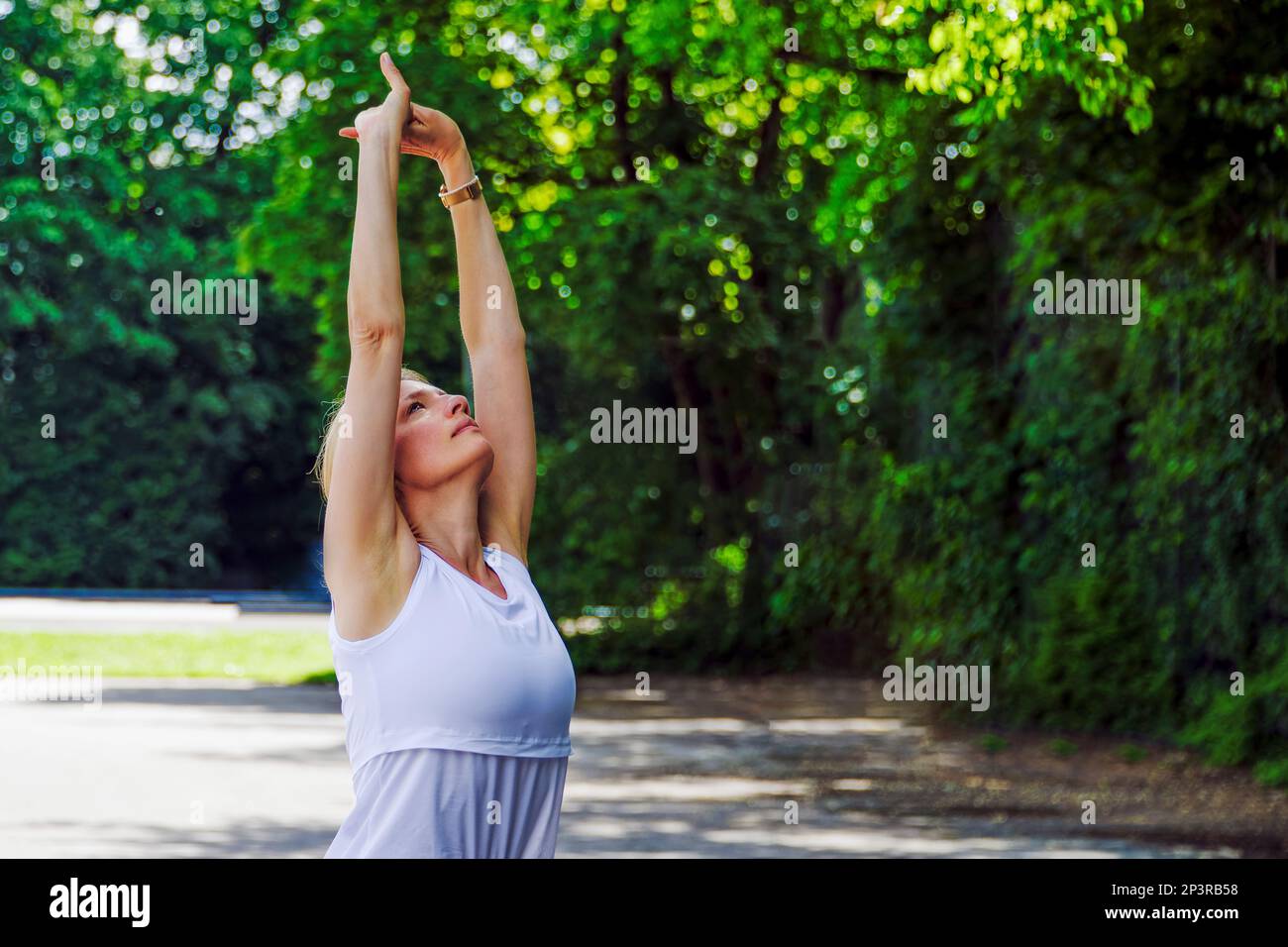 View of European women during a sport training outdoors on a public area in the summer Stock Photo