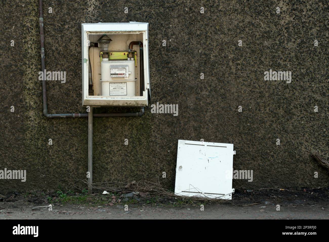 Broken residential gas utility box and meter on a wall, Scotland, UK, Europe Stock Photo