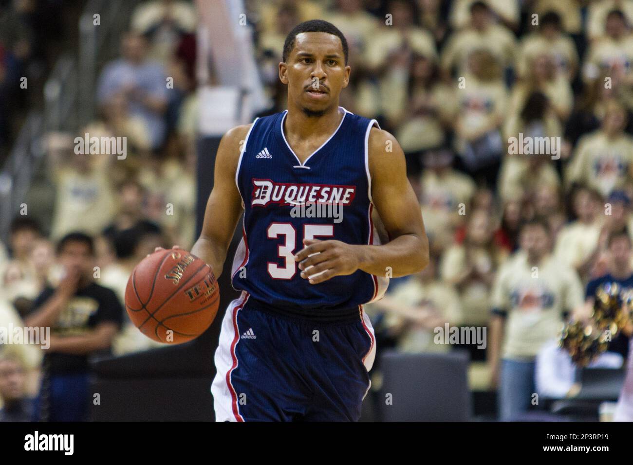 December 5 2014: Duquesne Dukes Guard Jordan Stevens (35) brings the ball  up court during the second half of the game between the Duquesne Dukes and  the Pittsburgh Panthers at the Consol