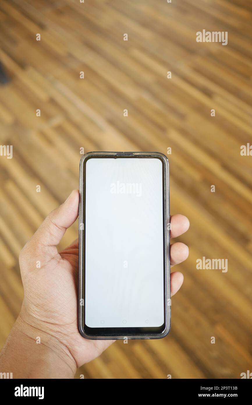 Close up of young man hand using smart phone with green screen Stock ...