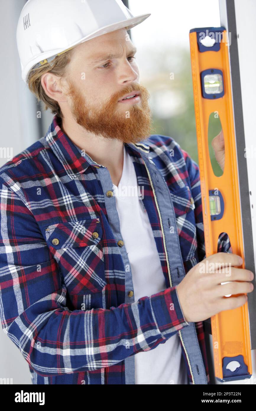 Vertical measure with a spirit level hi-res stock photography and ...