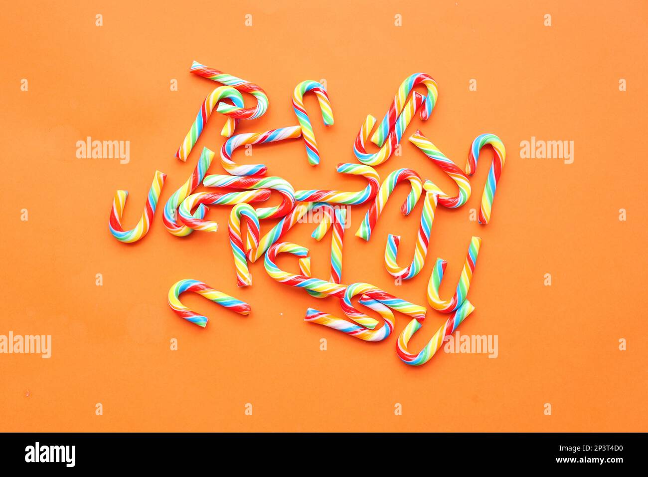 mini cherry candy canes on white background  Stock Photo