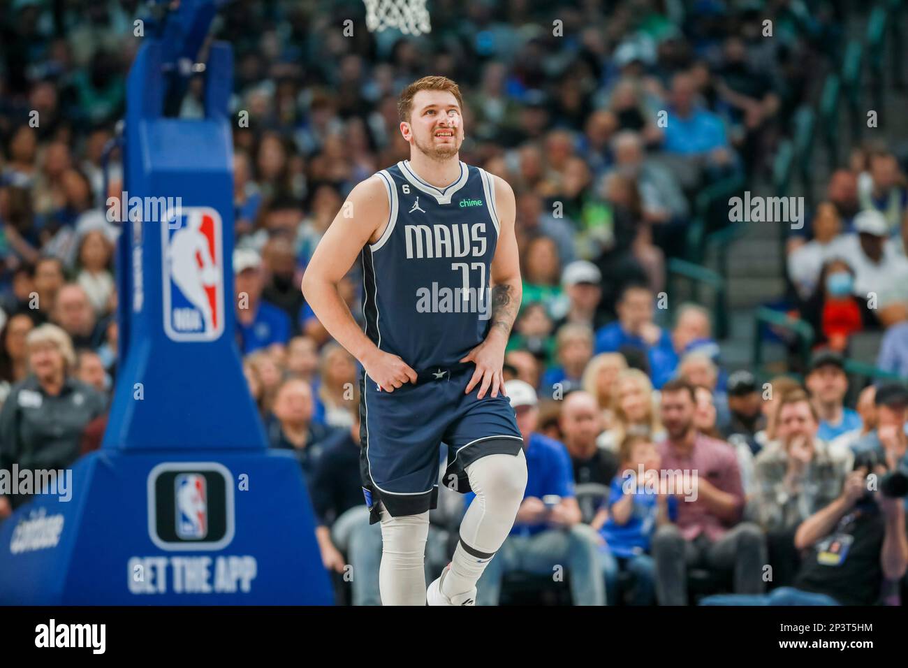 Dallas Mavericks guard Luka Doncic reacts after returning to the court ...