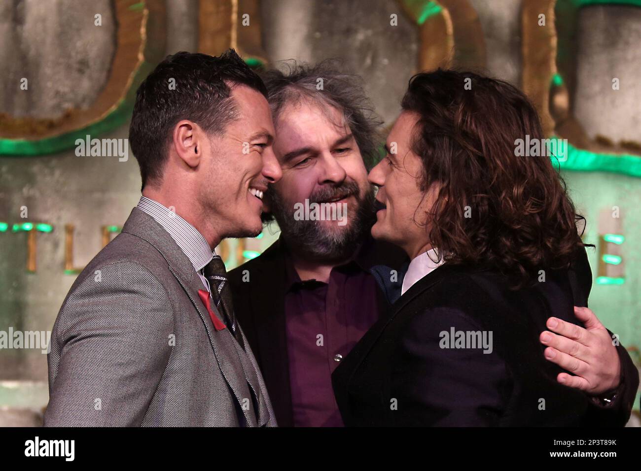 Actors Luke Evans, left and Orlando Bloom, right, speak with director