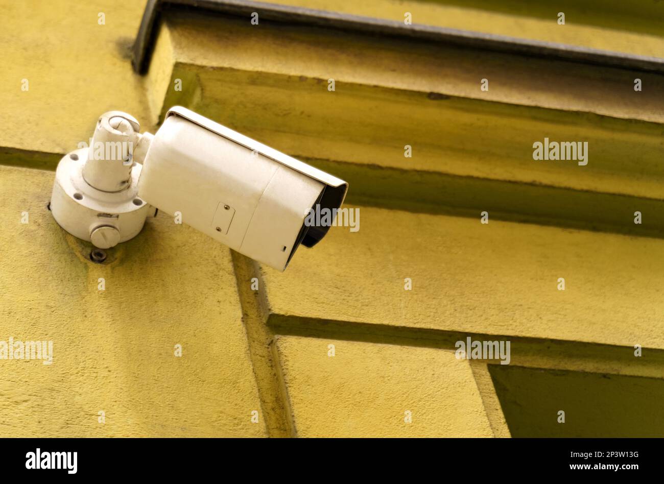 Surveillance camera installed on the wall of an old building. Video surveillance systems Stock
