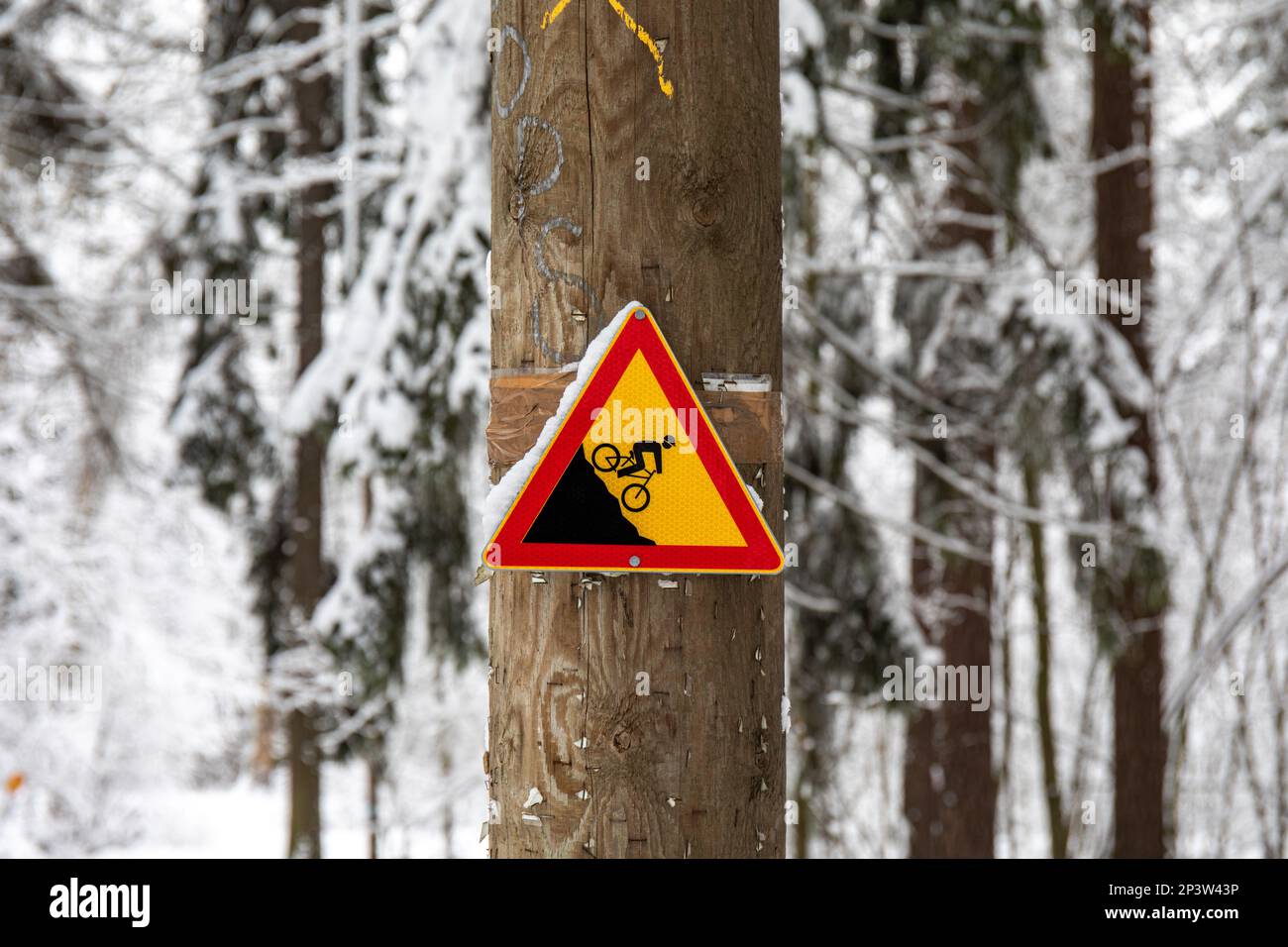 Steep slope warning sign for cyclists in Ruskeasuo, Helsinki, Finland Stock Photo