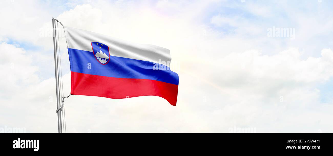 Slovenia flag waving on sky background. 3D Rendering Stock Photo - Alamy