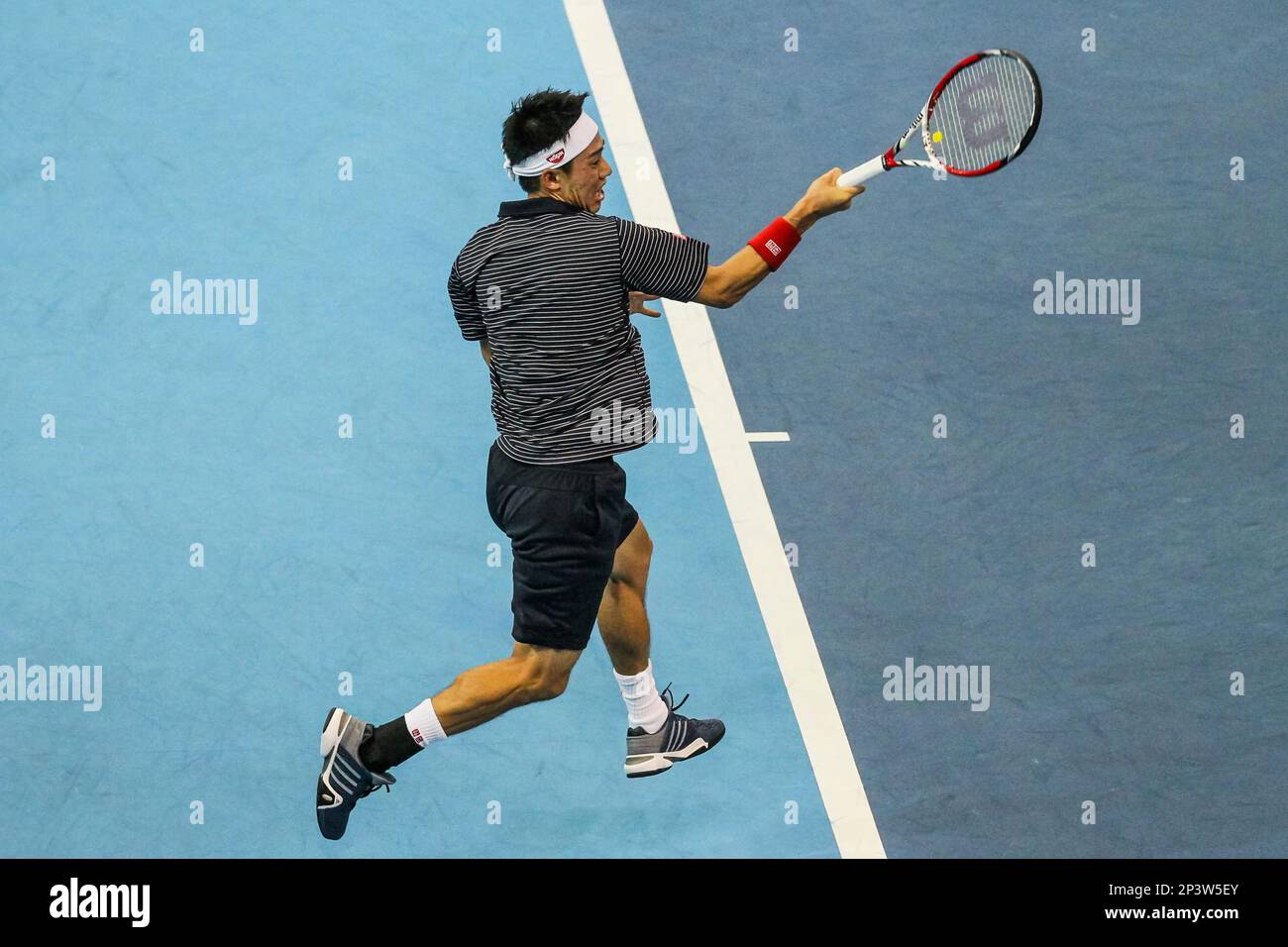 28 September 2014: Kei Nishikori of Japan in action during his 7-6(4), 6-4  win over Julien Benneteau of France in the final match of ATP World Tour  250 Malaysian Open, Kuala Lumpur