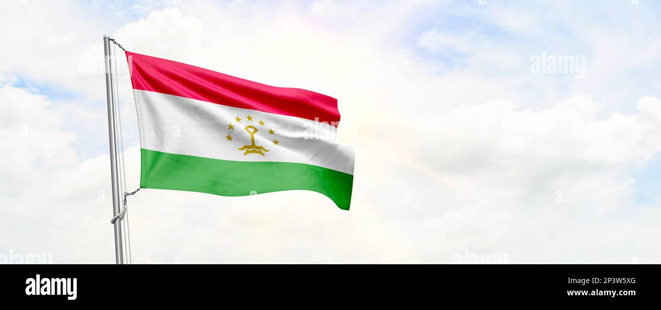 Tajikistan flag waving on sky background. 3D Rendering Stock Photo