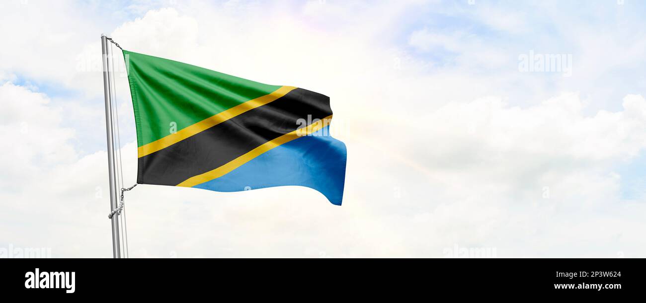 Tanzania flag waving on sky background. 3D Rendering Stock Photo - Alamy