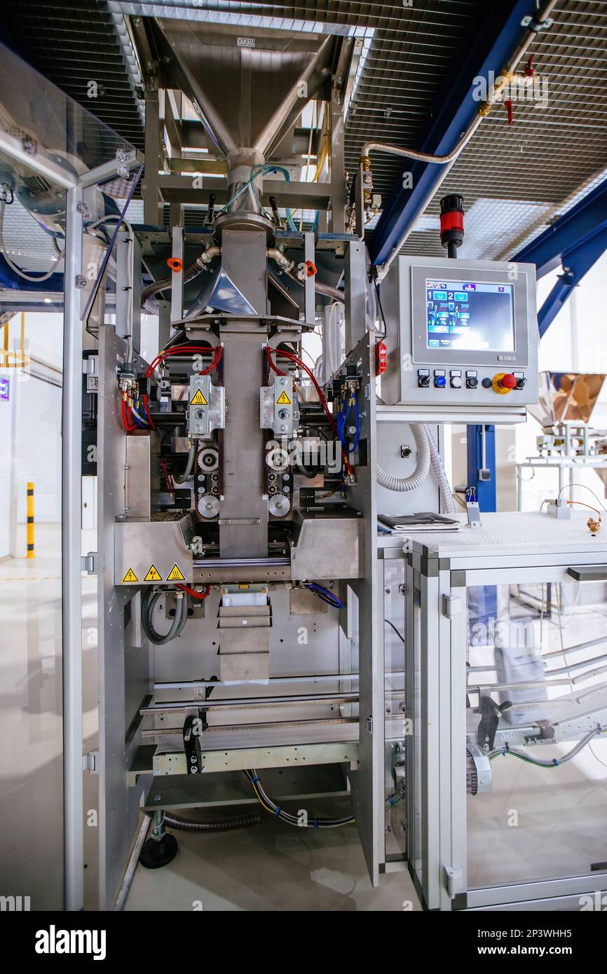 Modern industrial coffee packaging machine Stock Photo Alamy
