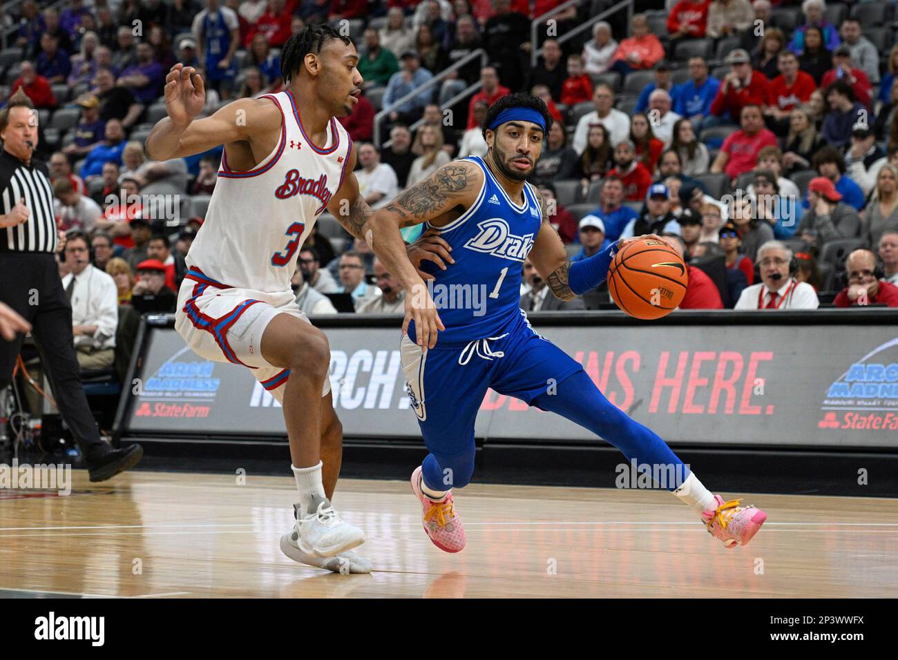 Drake guard Roman Penn (1) drives to the net as Bradley guard Zek