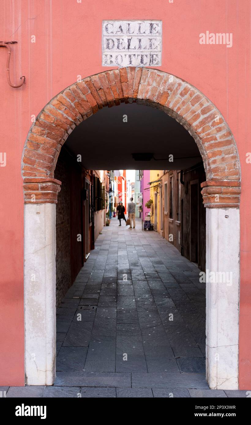 Coloured archway at Calle Del Botte, Burano, Venice lagoon, Italy Stock Photo