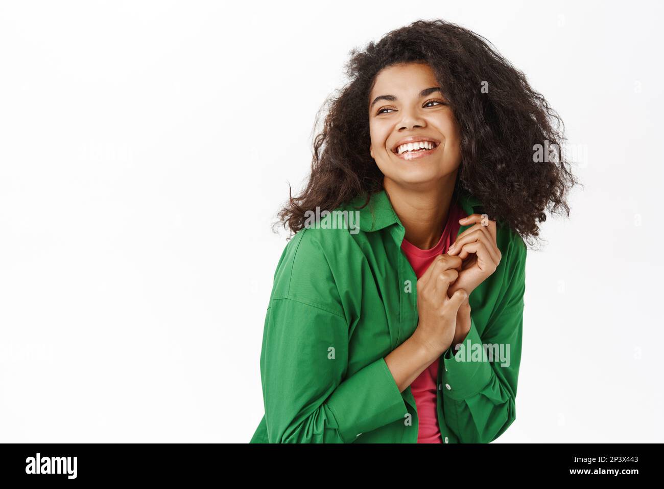 Portrait of young african american girl with curly hair, smiles and ...