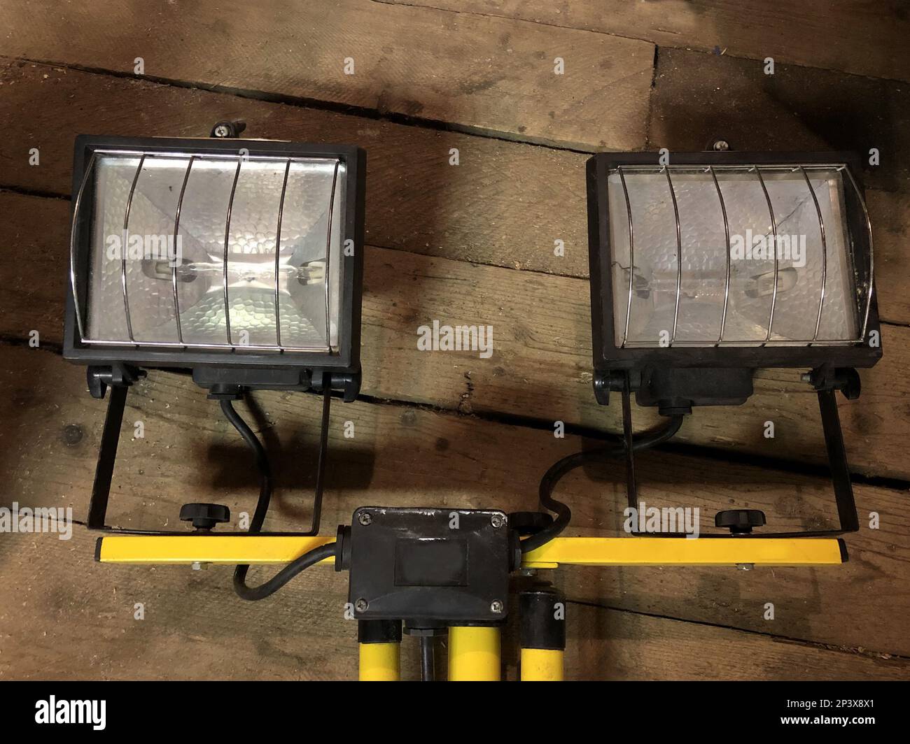 two halogen spotlights in a wooden barn Stock Photo Alamy
