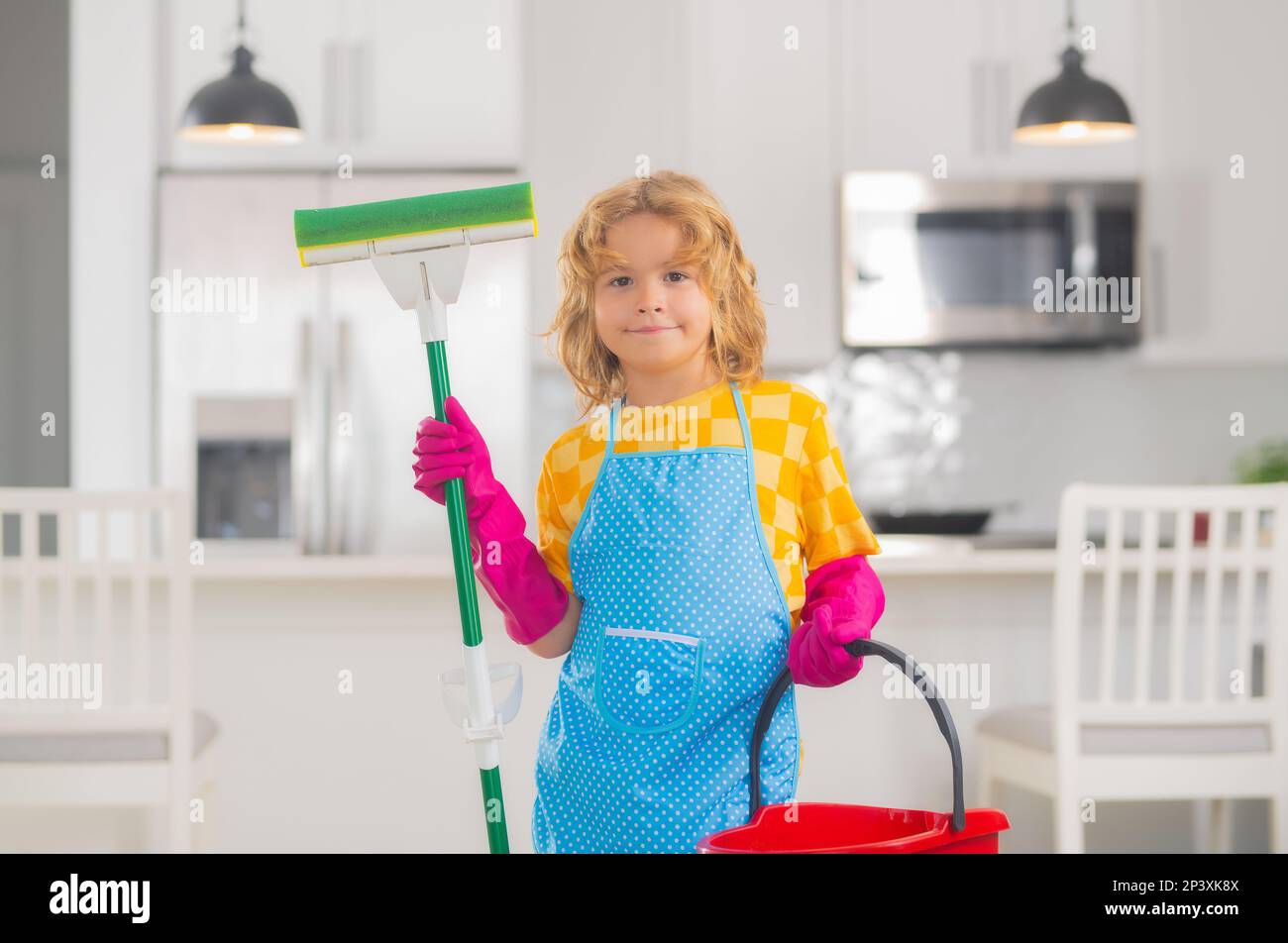 Child mopping house, cleaning home. Detergents and cleaning accessories.  Cleaning service. Little boy housekeeping Stock Photo - Alamy