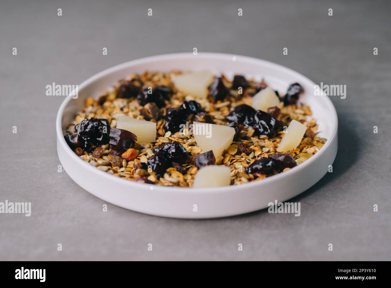 Delicious muesli on a plate in a restaurant. Stock Photo