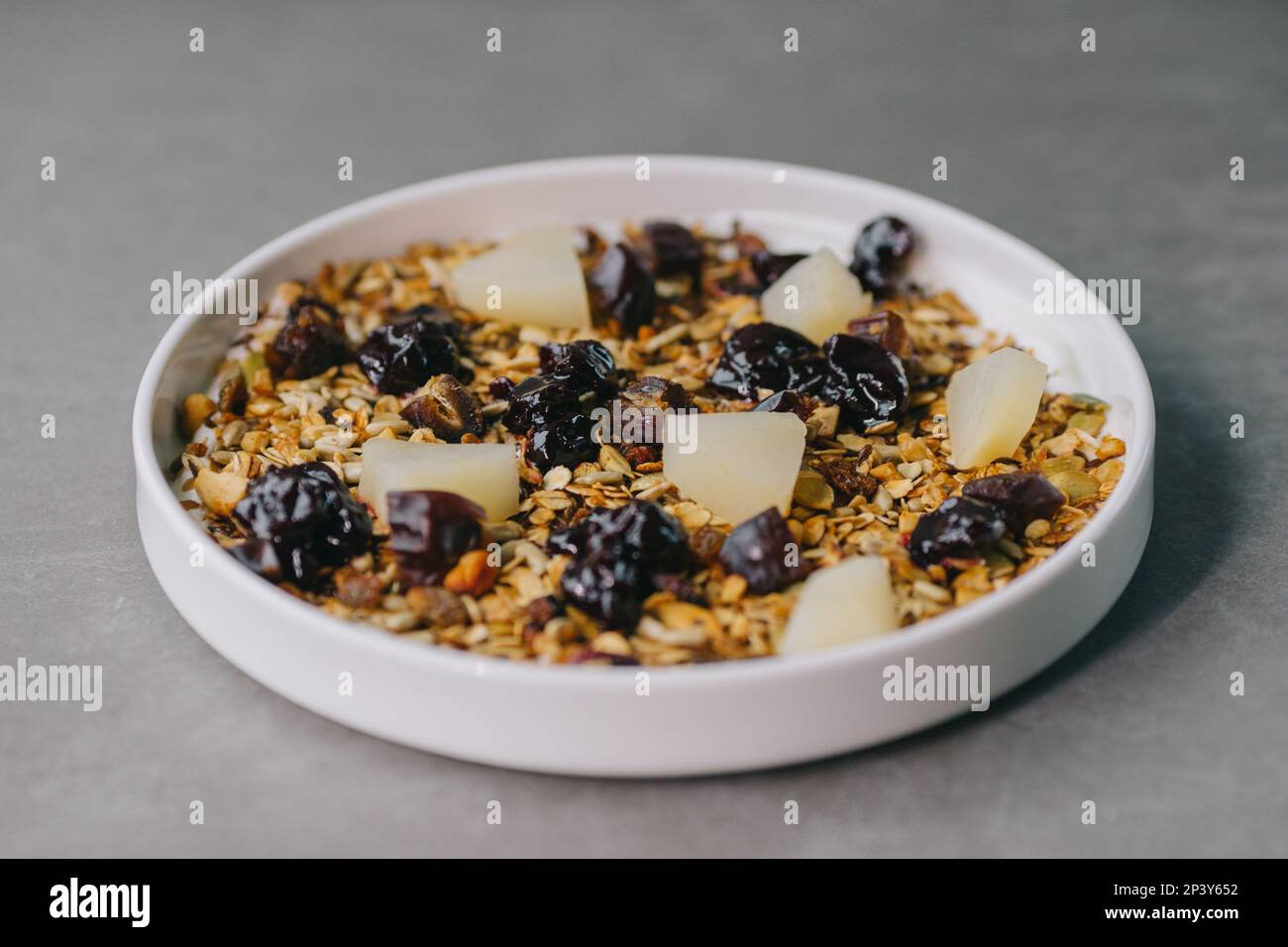 Delicious muesli on a plate in a restaurant. Stock Photo
