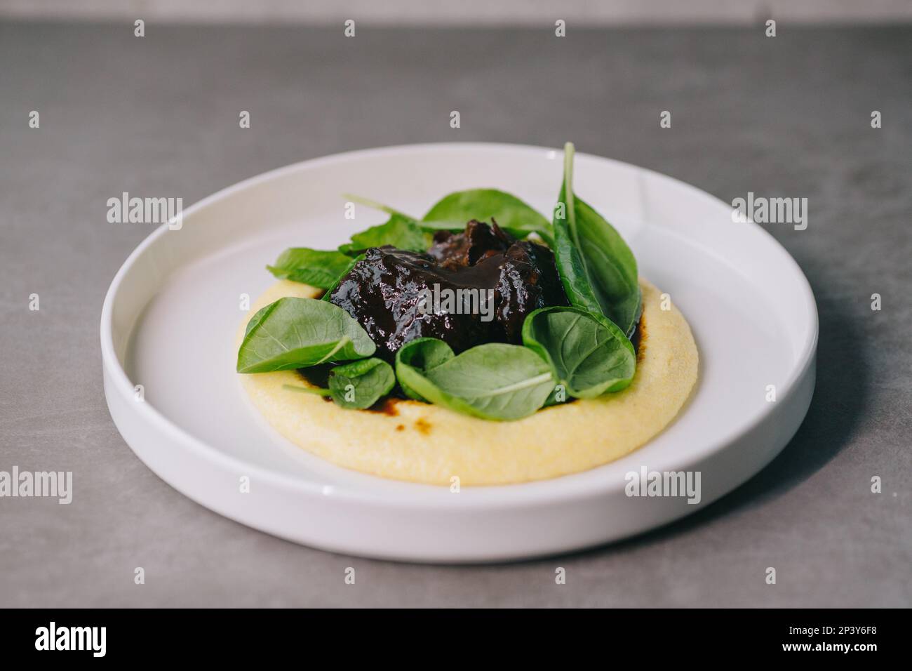 Food on an elegant white plate, lunch or dinner dish. Delicious food in a restaurant close-up. Stock Photo