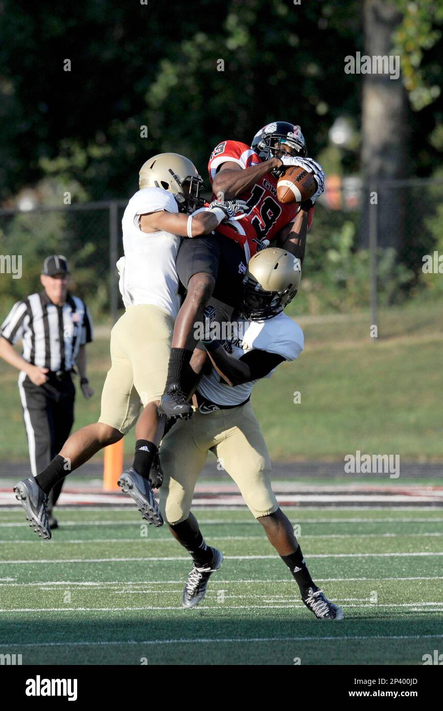 2014 September 20: Kenny Cook (19) WR Gardner-Webb University Runnin  Bulldogs catches the pass and is tackled by Chris Armfield (2) CB Wofford  College Terriers and Jaleel Green (11) FS Wofford College