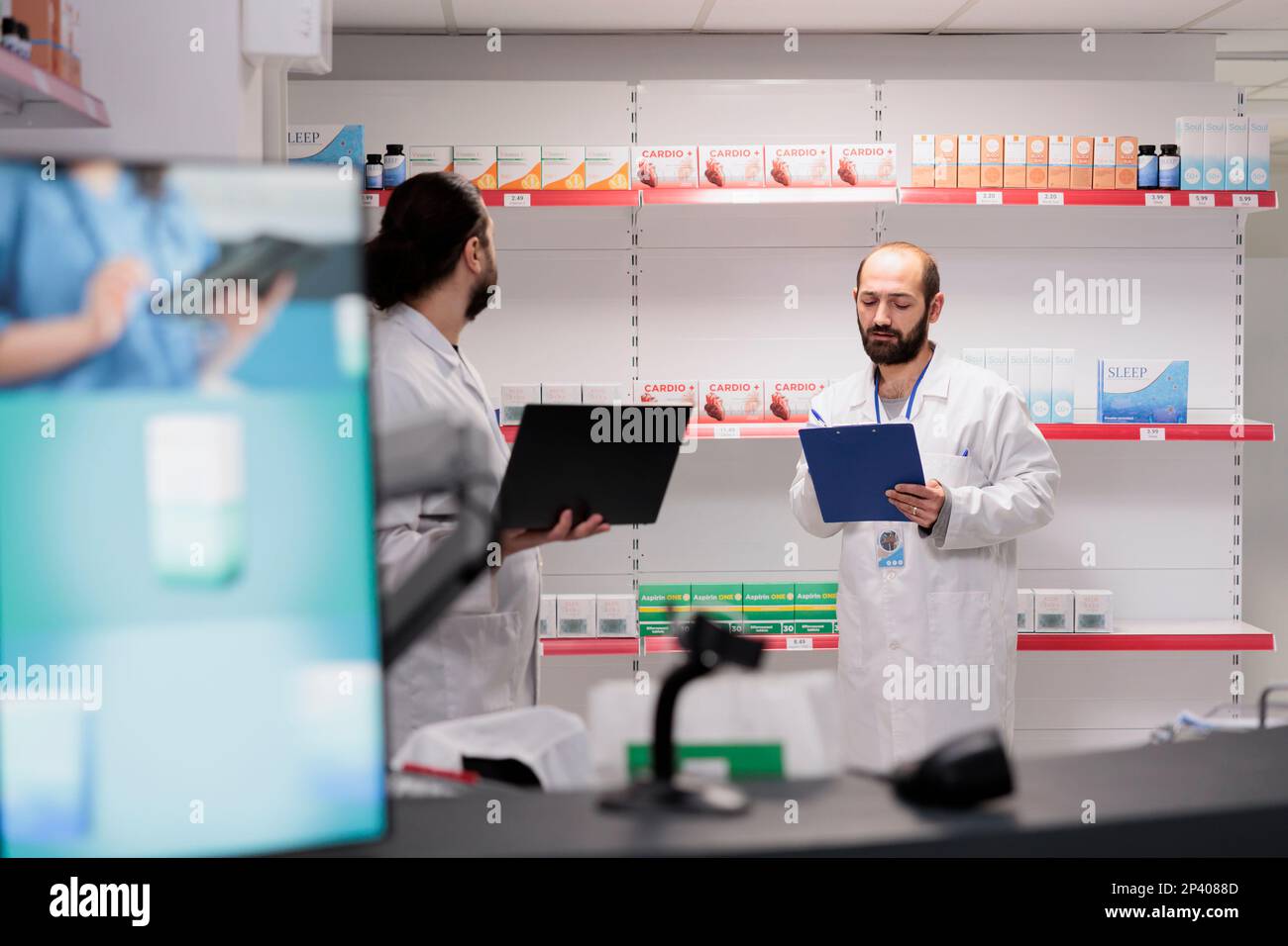 Drugstore workers working at pharmaceutical pills inventory checking