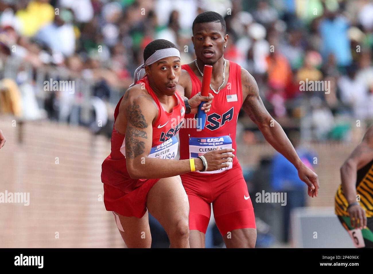 April 26, 2014: USA's Kyle Clemons hands the baton to Kind Butler
