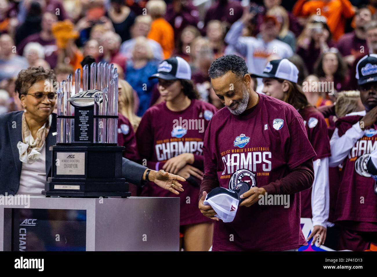 Greensboro, NC, USA. 5th Mar, 2023. Virginia Tech Hokies head coach Kenny Brooks steps up to receive the Championship trophy after deafening the Louisville Cardinals in the finals of the Women's ACC Tournament at Greensboro Coliseum in Greensboro, NC. (Scott Kinser/Cal Sport Media). Credit: csm/Alamy Live News Stock Photo