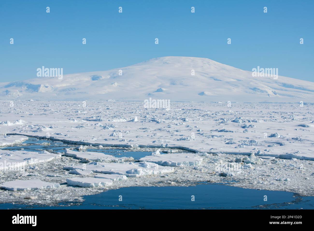 Antarctica, Amundsen Sea, Siple Island. Sea ice with Mount Siple
