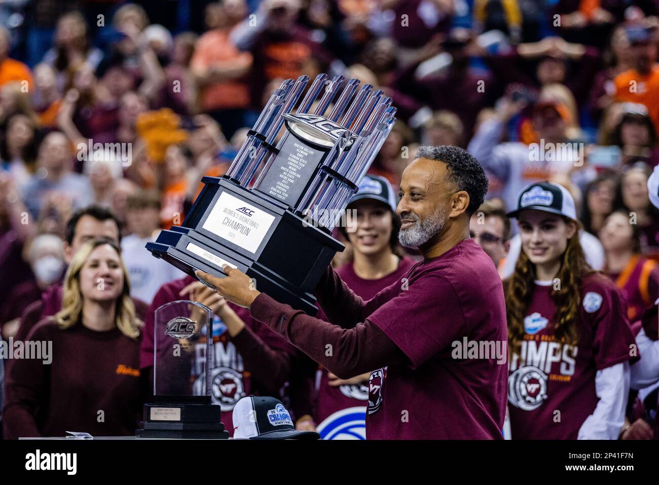 Greensboro, NC, USA. 5th Mar, 2023. Virginia Tech Hokies head coach Kenny Brooks holds up the Championship trophy after defeating the Louisville Cardinals in the finals of the Women's ACC Tournament at Greensboro Coliseum in Greensboro, NC. (Scott Kinser/Cal Sport Media). Credit: csm/Alamy Live News Stock Photo