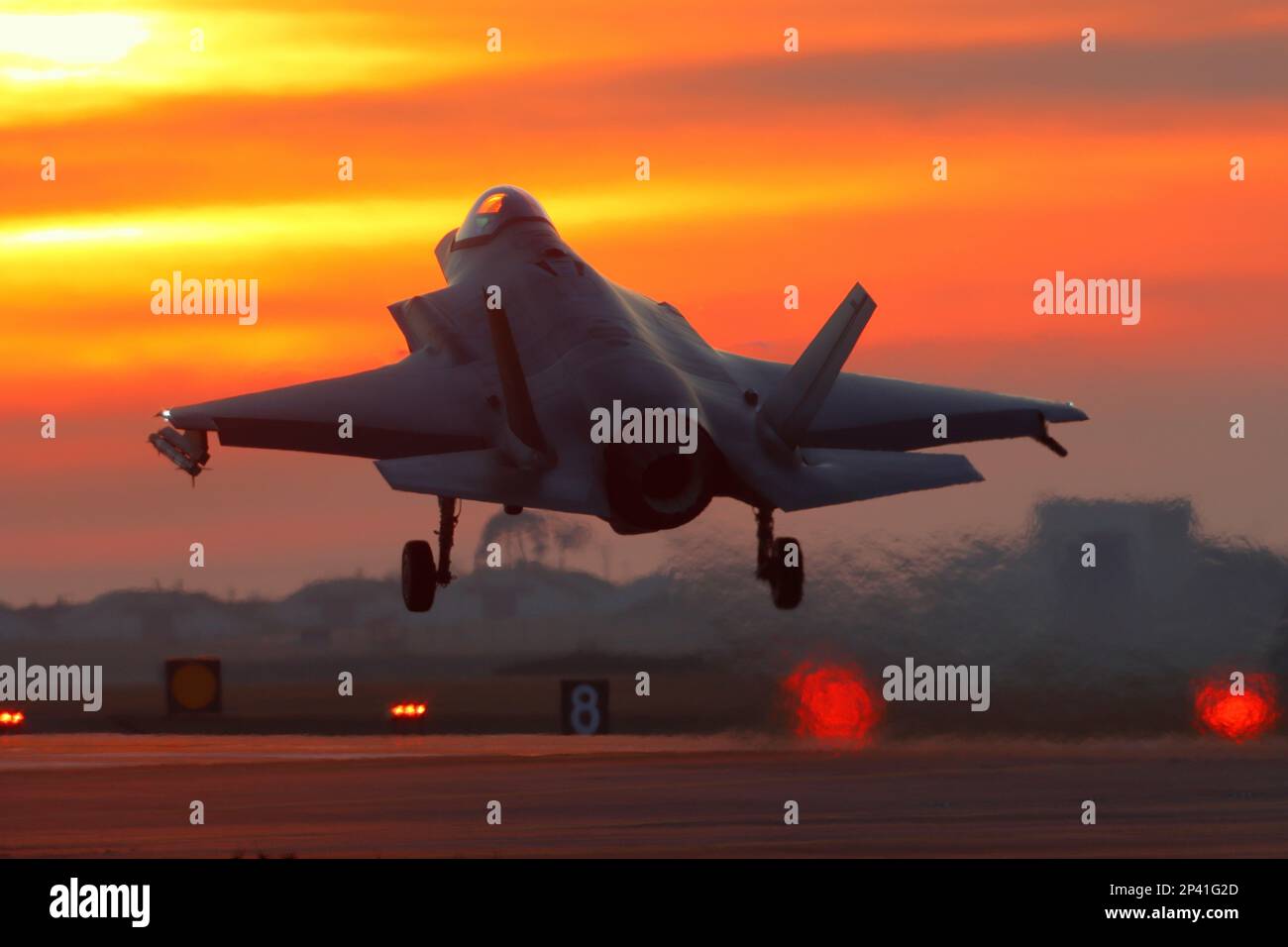 USAF Lockheed Martin F-35A Lightning II landing at sunset, RAF Lakenheath. Stock Photo