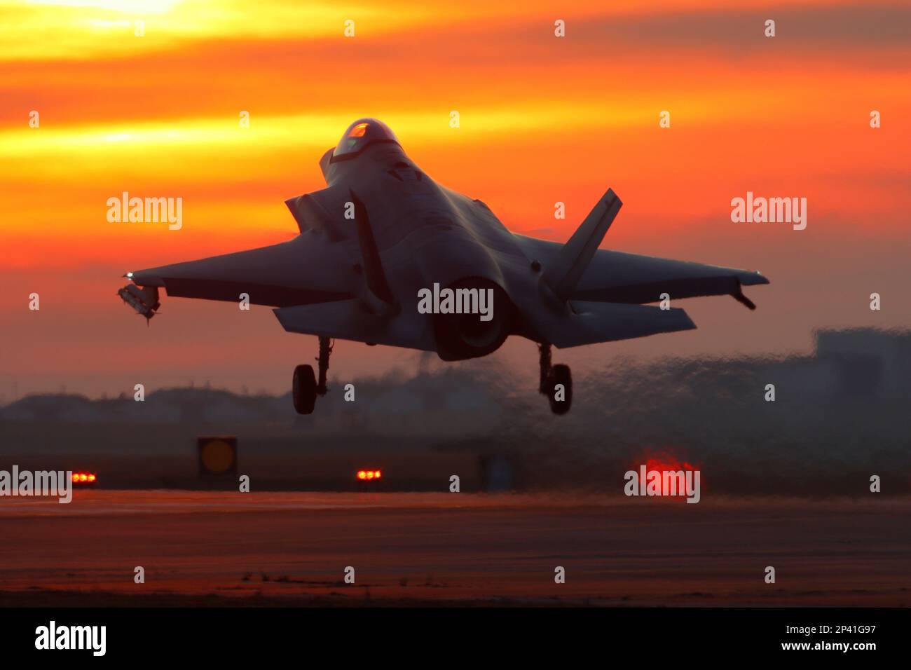 USAF Lockheed Martin F-35A Lightning II landing at sunset, RAF Lakenheath. Stock Photo