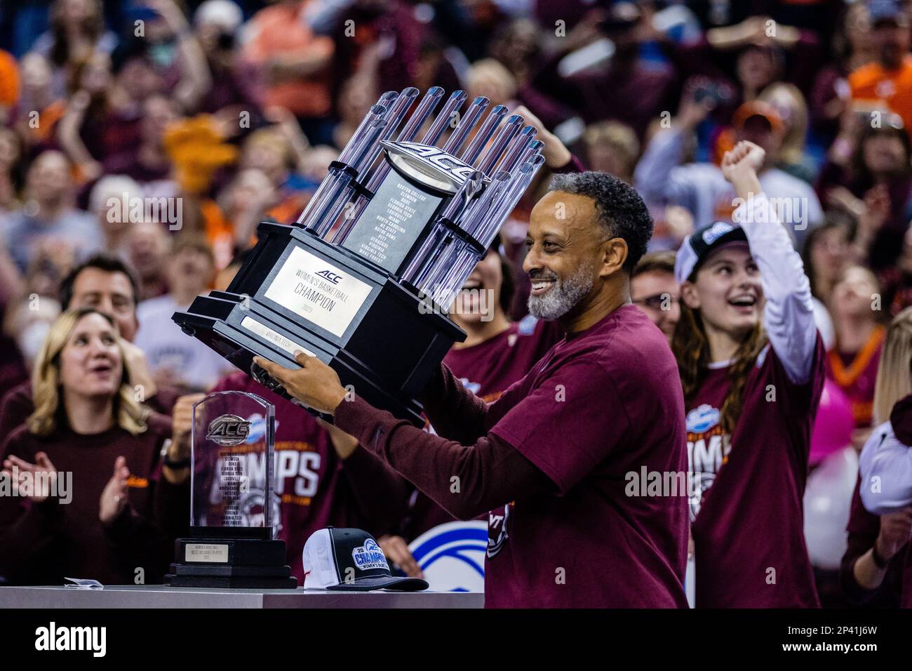 Greensboro, NC, USA. 5th Mar, 2023. Virginia Tech Hokies head coach Kenny Brooks holds up the Championship trophy after defeating the Louisville Cardinals in the finals of the Women's ACC Tournament at Greensboro Coliseum in Greensboro, NC. (Scott Kinser/Cal Sport Media). Credit: csm/Alamy Live News Stock Photo