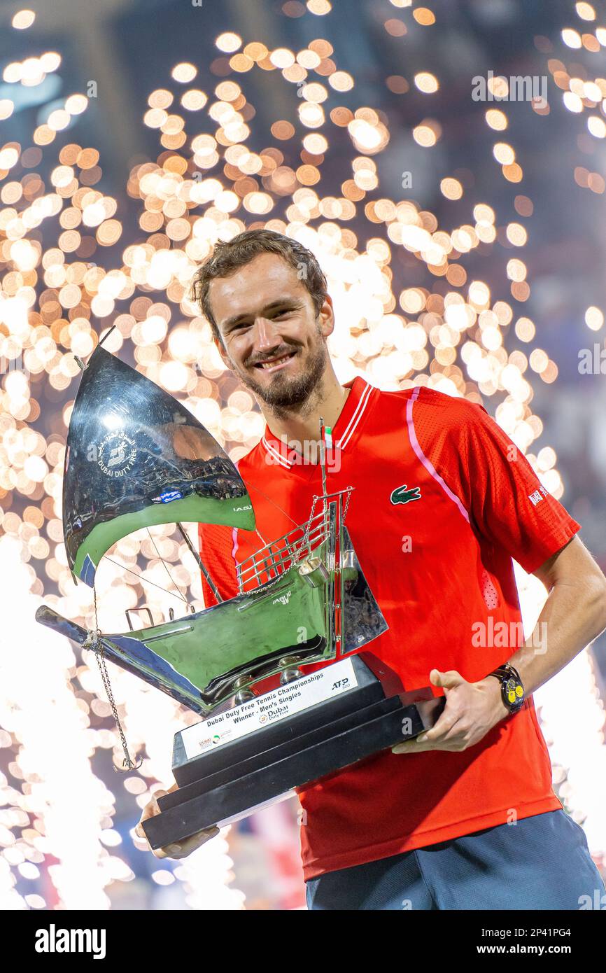 Daniil Medvedev poses with a trophy after the finals of the Dubai Duty Free tennis tournament at Dubai Tennis stadium