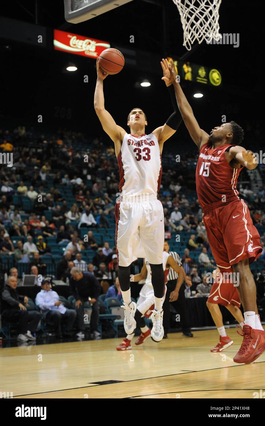 12 March 2014: Stanford (33) Dwight Powell fouls Washington State (25)  DaVonte Lacy during the men's Pac-12 basketball tournament game between the  Stanford Cardinal and the Washington State Cougars at the MGM