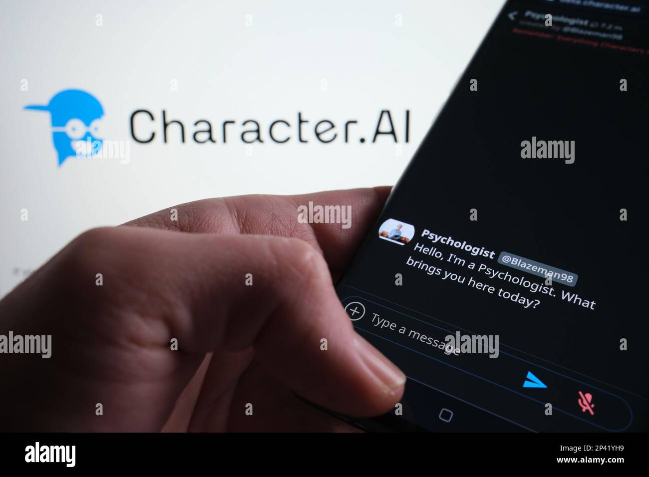 Character AI Chatbot example seen on smartphone screen. Blurred Character.AI logo on the background. Stafford, UK, March 5, 2023 Stock Photo