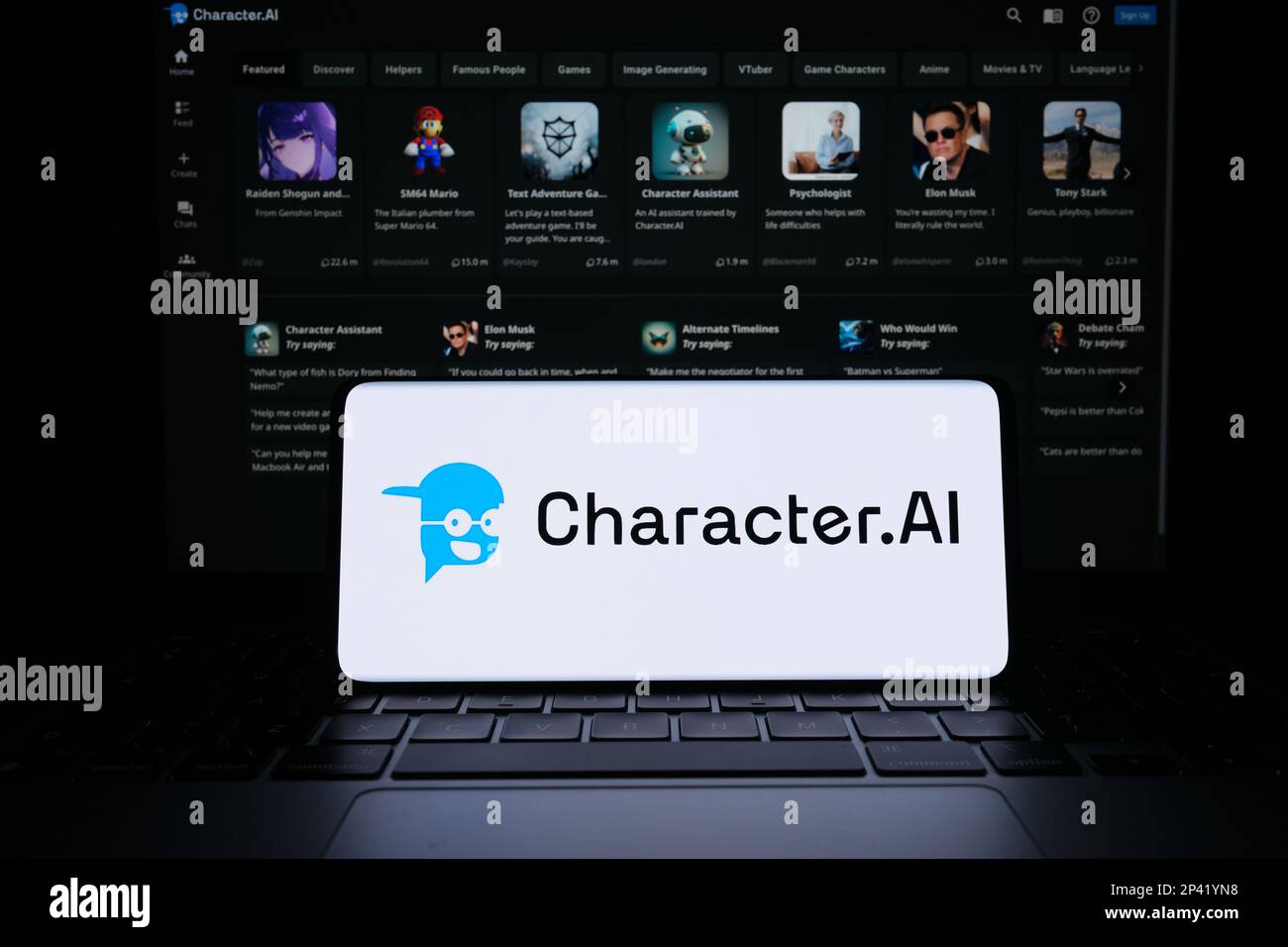 Character AI logotype seen on smartphone screen. Blurred Character.AI website on the background. Stafford, UK, March 5, 2023 Stock Photo