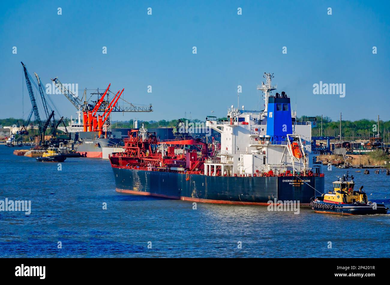 Overseas Cascade is pictured as it enters the Port of Mobile assisted by the tugboat Lisa Cooper, March 3, 2023, in Mobile, Alabama. Stock Photo