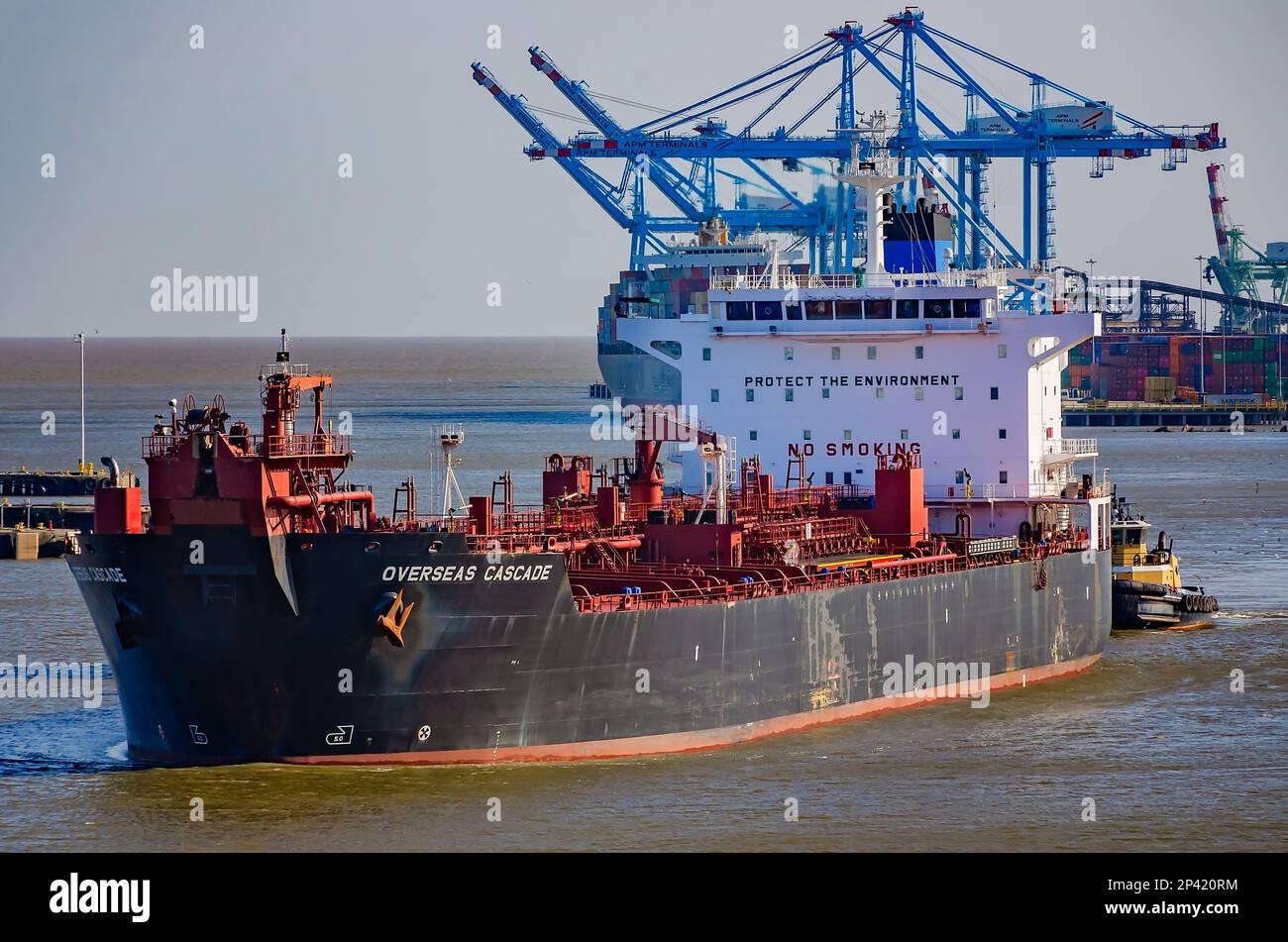 Overseas Cascade is pictured as it enters the Port of Mobile assisted by the tugboat Lisa Cooper, March 3, 2023, in Mobile, Alabama. Stock Photo