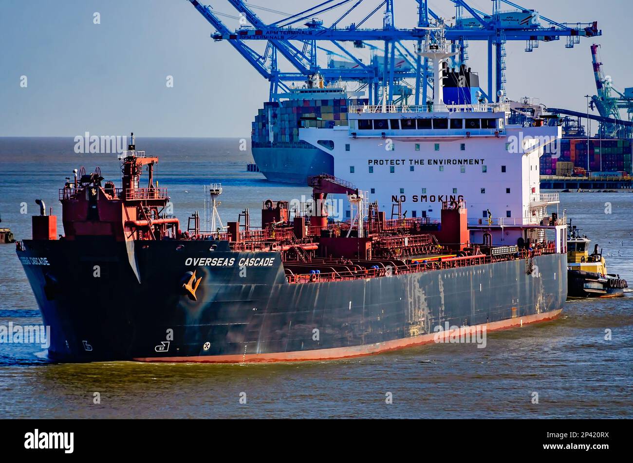 Overseas Cascade is pictured as it enters the Port of Mobile assisted by the tugboat Lisa Cooper, March 3, 2023, in Mobile, Alabama. Stock Photo