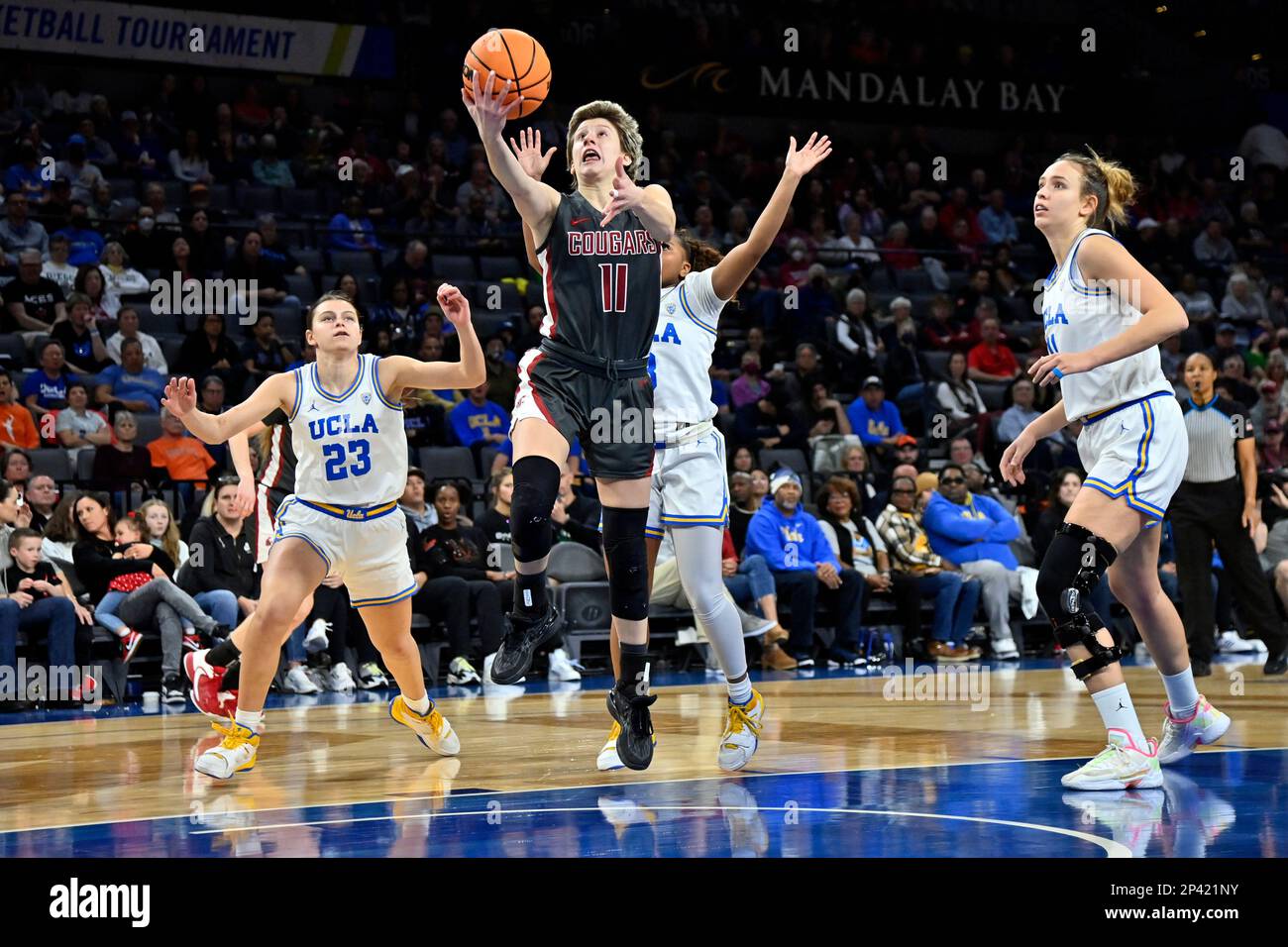 Washington State guard Astera Tuhina (11) lays up the ball against UCLA