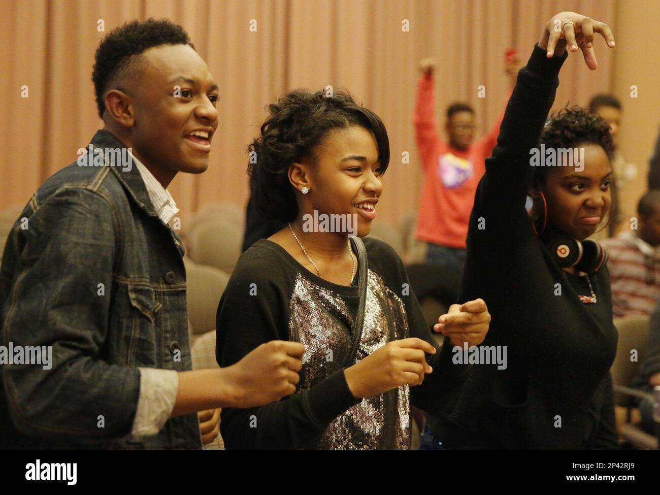 In a Thursday, Oct. 23, 2014 photo, Stax Music Academy students, from left,  DeKarius Dawson, Zalissa Stewart and Brenae Johnson encourage a classmate  who was performing during the IU Soul Revue class