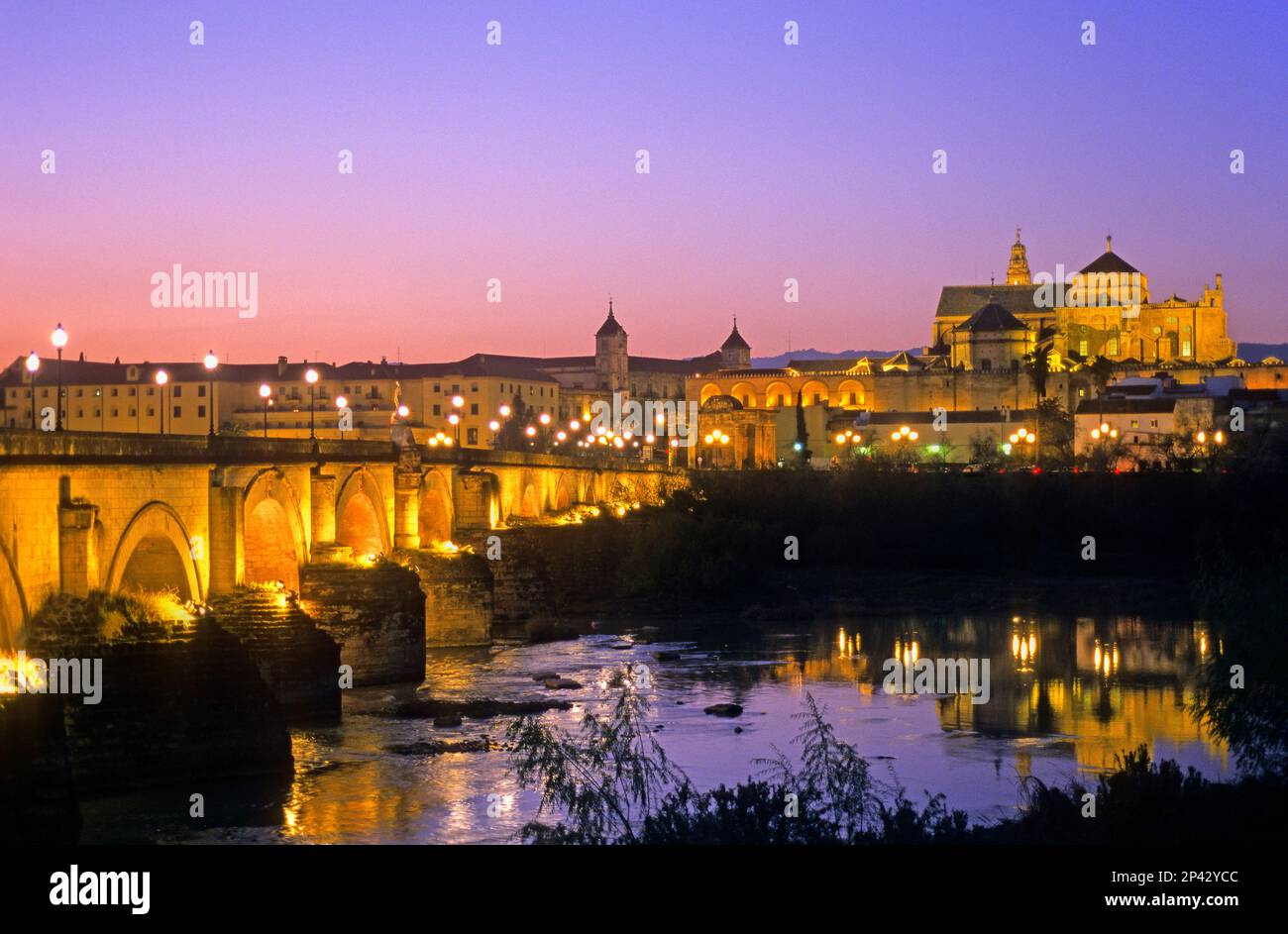 Cordoba.Andalusia. Spain: Mosque Cathedral and Roman Bridge, as seen from Guadalquivir river Stock Photo