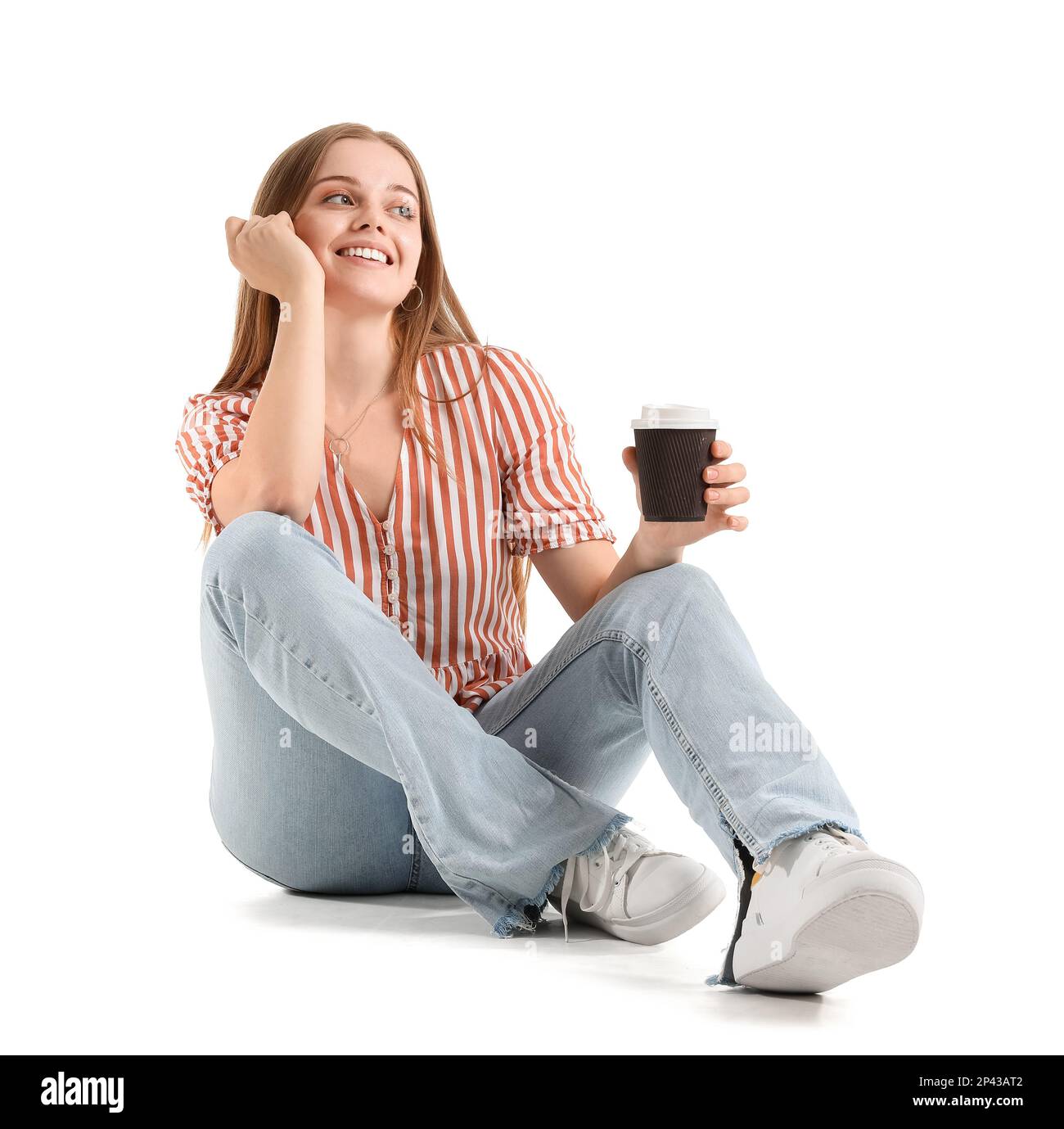 Beautiful girl with cup of coffee sitting on white background Stock ...