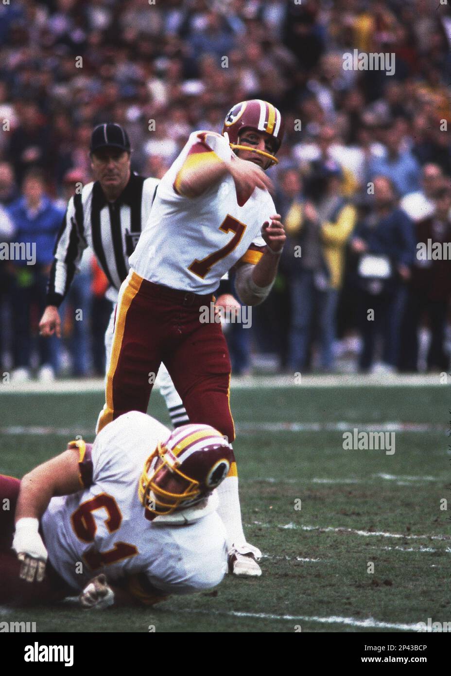 Washington Redskins quarterback Joe Theismann (7) gets ready to throw a  pass down field against the